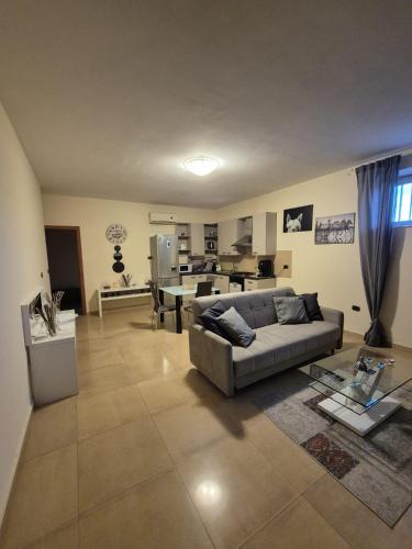a living room with a couch and a table at Casa Moschetti in Capodrise