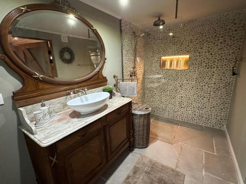 a bathroom with a sink and a mirror at maison Clavita in Genk