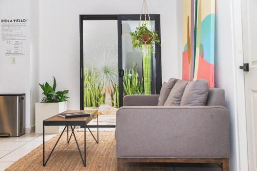 a living room with a couch and a table at Outsite Los Cabos - Entire 4-Bedroom Home in San José del Cabo