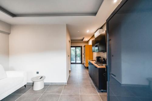a bathroom with a toilet and a sink at Nima Suites Corfu in Marathias