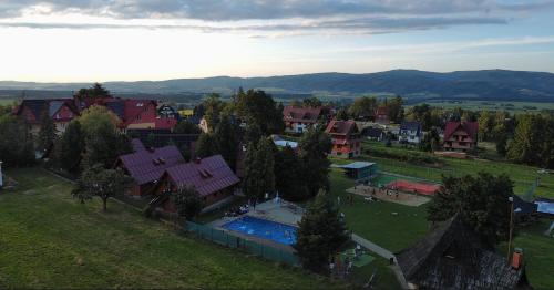 an aerial view of a town with a swimming pool at Ośrodek Wczasowy Groń Placówka in Białka Tatrzańska