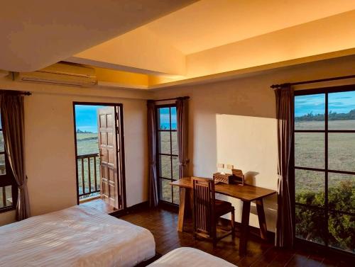 En eller flere senge i et værelse på Fun Cows