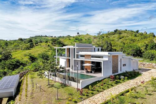 an aerial view of a house with a solarium at Passot Hills - Villas Premium in Nosy Be