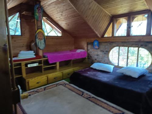 En eller flere senge i et værelse på El SOL al ALVA