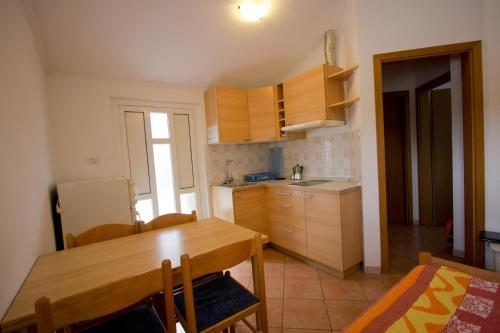 Kuchyň nebo kuchyňský kout v ubytování Apartment & Cottage Paliska