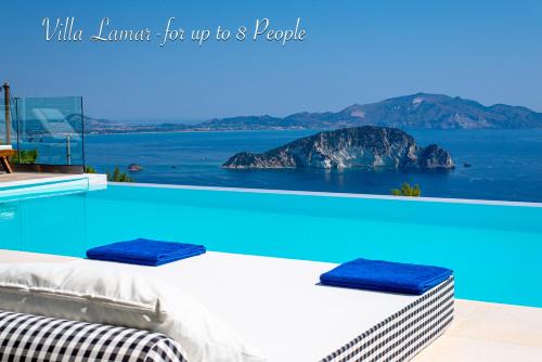 a bedroom with a pool with a view of the ocean at Villa Lamar Private Luxury Villa in Marathias