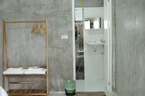 a bathroom with a shower with a sink and a toilet at Krabi Aonang happy resort in Ao Nam Mao