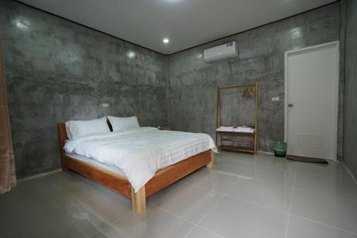 a bedroom with a large bed in a room at Krabi Aonang happy resort in Ao Nam Mao