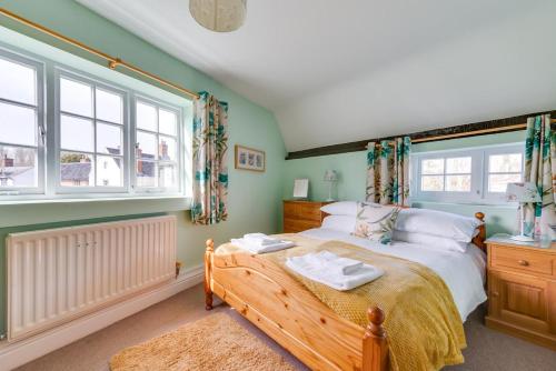 a bedroom with a bed and a large window at 2 Bed in Wangford oc-8hsw in Wangford