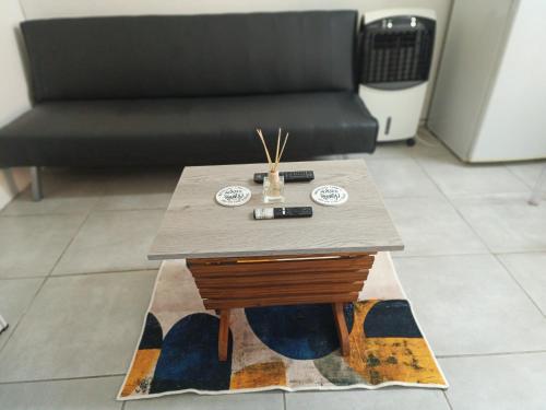 a coffee table in a living room with a couch at Cozy Flat in East London