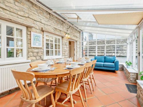 a dining room with a wooden table and chairs at 4 Bed in Wareham oc-dc125 in Corfe Castle