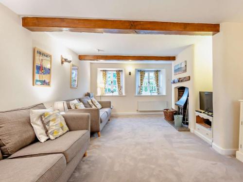 a living room with a couch and a tv at 4 Bed in Wareham oc-dc125 in Corfe Castle