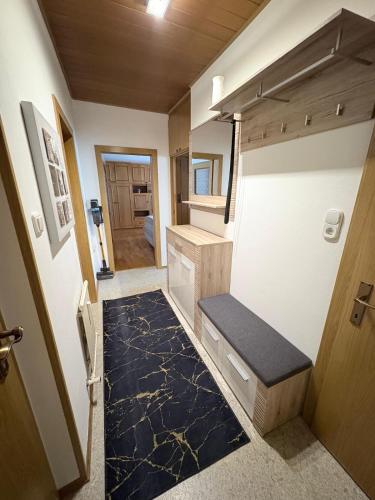 an interior view of an rv with a black floor at Ferienwohnung Veitsch in Niederaigen