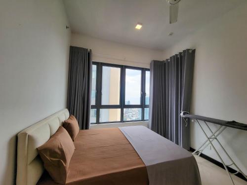 a bedroom with a bed with a large window at Sea view Apartmen in Trizen in Colombo