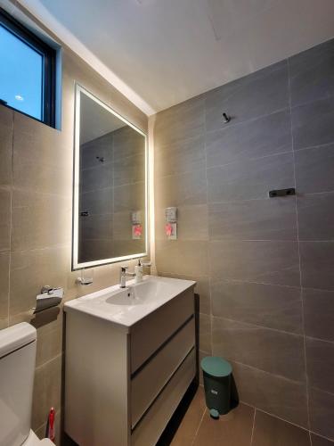a bathroom with a sink and a mirror at Sea view Apartmen in Trizen in Colombo
