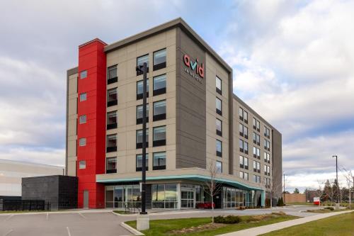 a large building with a red and gray at avid Hotel - Toronto - Vaughan Southwest by IHG in Vaughan