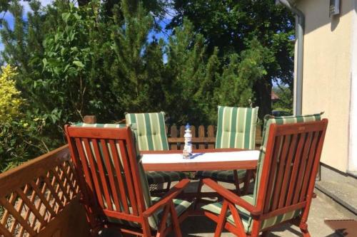a table and two chairs sitting on a patio at Bungalow Marina Tarnewitz in Tarnewitz