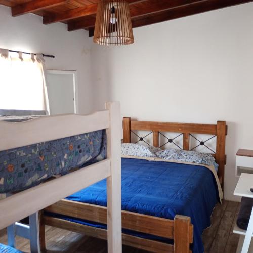 a bedroom with two bunk beds and a window at Terramar cabañas in Mar del Plata