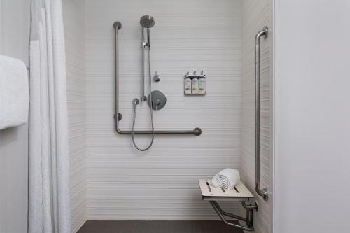 a shower in a bathroom with a shower curtain at avid Hotel - Toronto - Vaughan Southwest by IHG in Vaughan