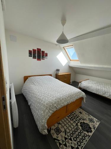Llit o llits en una habitació de Gîte le Ch'armançon