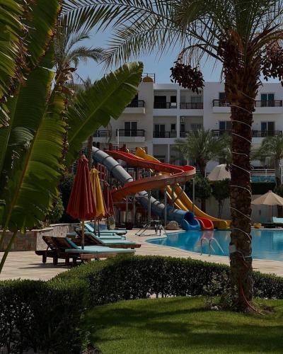 a water slide in a swimming pool in a resort at Jasmine in Sharm El Sheikh