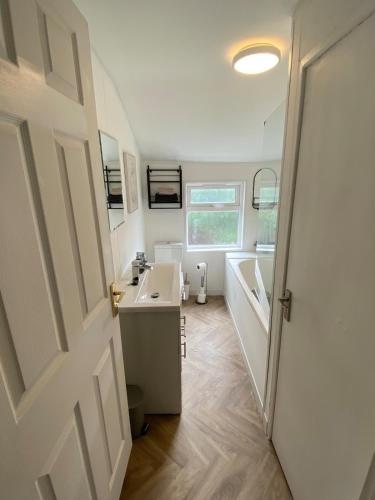 a bathroom with a sink and a toilet in a caravan at Slick Space for a Wigan Stay - 5 Minutes from M6 and M58 Motorways in Pemberton