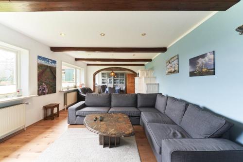 a living room with a couch and a table at Wietblick in Ockholm