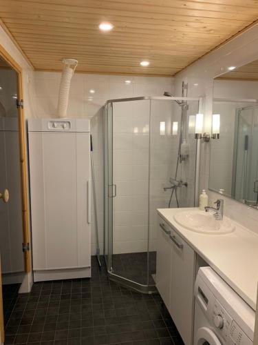 a bathroom with a shower and a sink at Ruka Chalets 1304 high quality apartment in Kuusamo