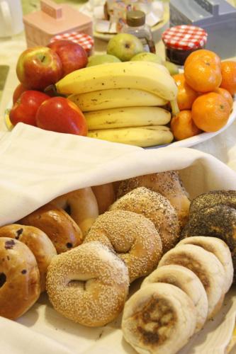a bunch of different types of food on a table at The Coolidge Corner Guest House: A Brookline Bed and Breakfast in Brookline