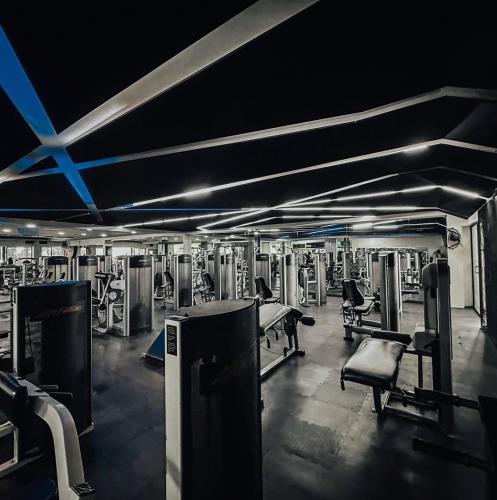 a gym with several rows of machines in it at Casa Bocobá in Oaxaca City