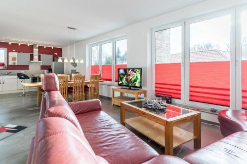 a living room with a couch and a table at Ferienwohnung "Colonia" in Klütz