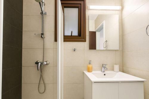 a bathroom with a shower and a sink at Old town studio in Limassol