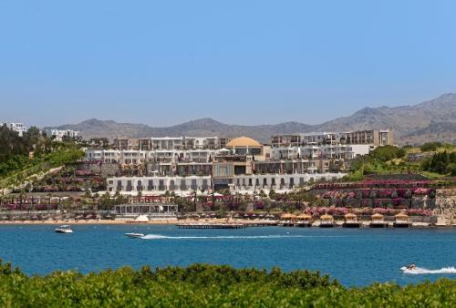 a resort on the shore of a body of water at Sianji Well-Being Resort in Turgutreis