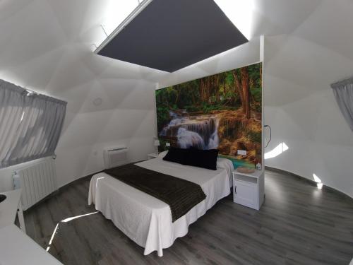Tempat tidur dalam kamar di Nyxia Dome