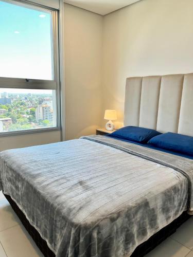 Postel nebo postele na pokoji v ubytování Edificio Home del Sol Asuncion