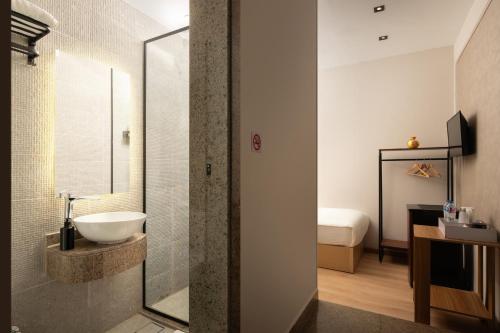 a bathroom with a sink and a shower at Cairo Capital Hotel by SK in Cairo