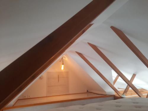 a room in the attic of a house at L'Abri Côtier 2 in Les Sables-d'Olonne