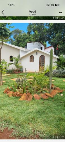 a house with a garden in front of it at Sítio monte alegre in Sobral