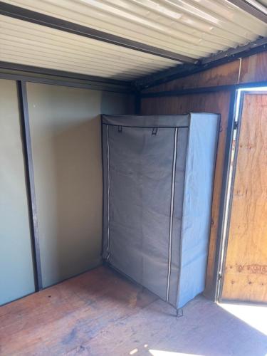 a closet in a house under a ceiling at Okatjongoro Campsite in Gkamboro Settlement