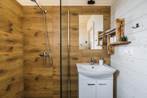 a bathroom with a sink and a shower at Orawska Sielanka in Roztoki