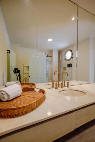 a bathroom with a large sink and a shower at Casa Stella - Authentic Luxury Rooftop Pool in Cartagena de Indias