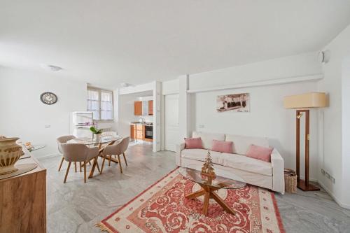 a living room with a couch and a table at Apartment Maira in Chiavenna