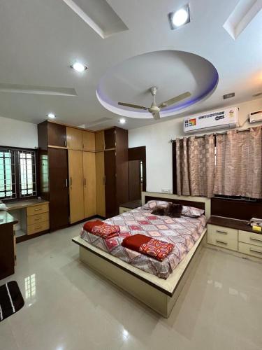 a bedroom with a bed and a ceiling at The 9th Oasis in Hyderabad