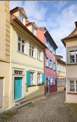 a row of colorful houses on a cobblestone street at Schlafstube Bamberg in Bamberg