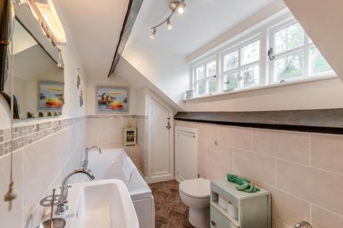 a bathroom with a sink and a toilet at 4 Bed in Arthog oc-b31966 in Arthog