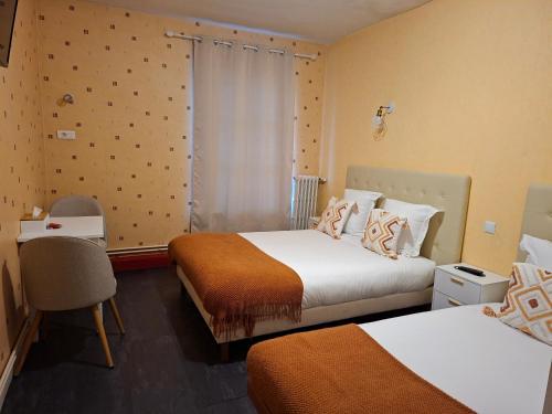 Posteľ alebo postele v izbe v ubytovaní Hôtel JurJura