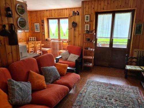 a living room with a couch and two chairs at Ca' Delle Nevi in SantʼAntonio