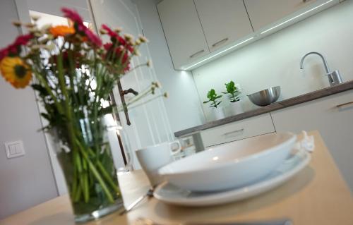 Η κουζίνα ή μικρή κουζίνα στο Apartamenty Leszno