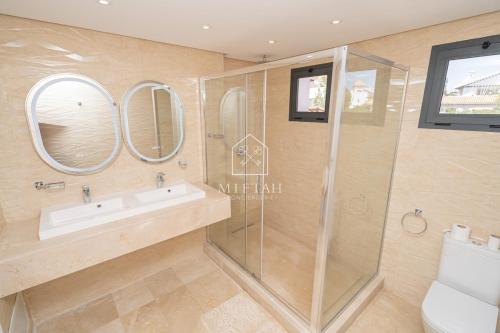 a bathroom with a sink and a shower at Luxury Villa with Private Pool STR1 in Tangier