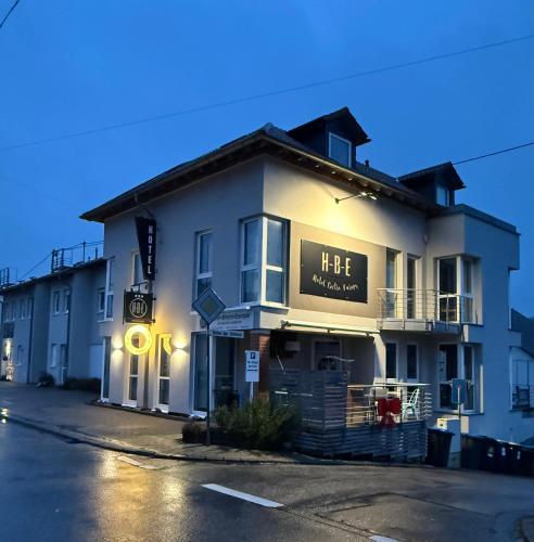 a large white building with a sign on it at Hotel-Bistro-Europa in Merchweiler